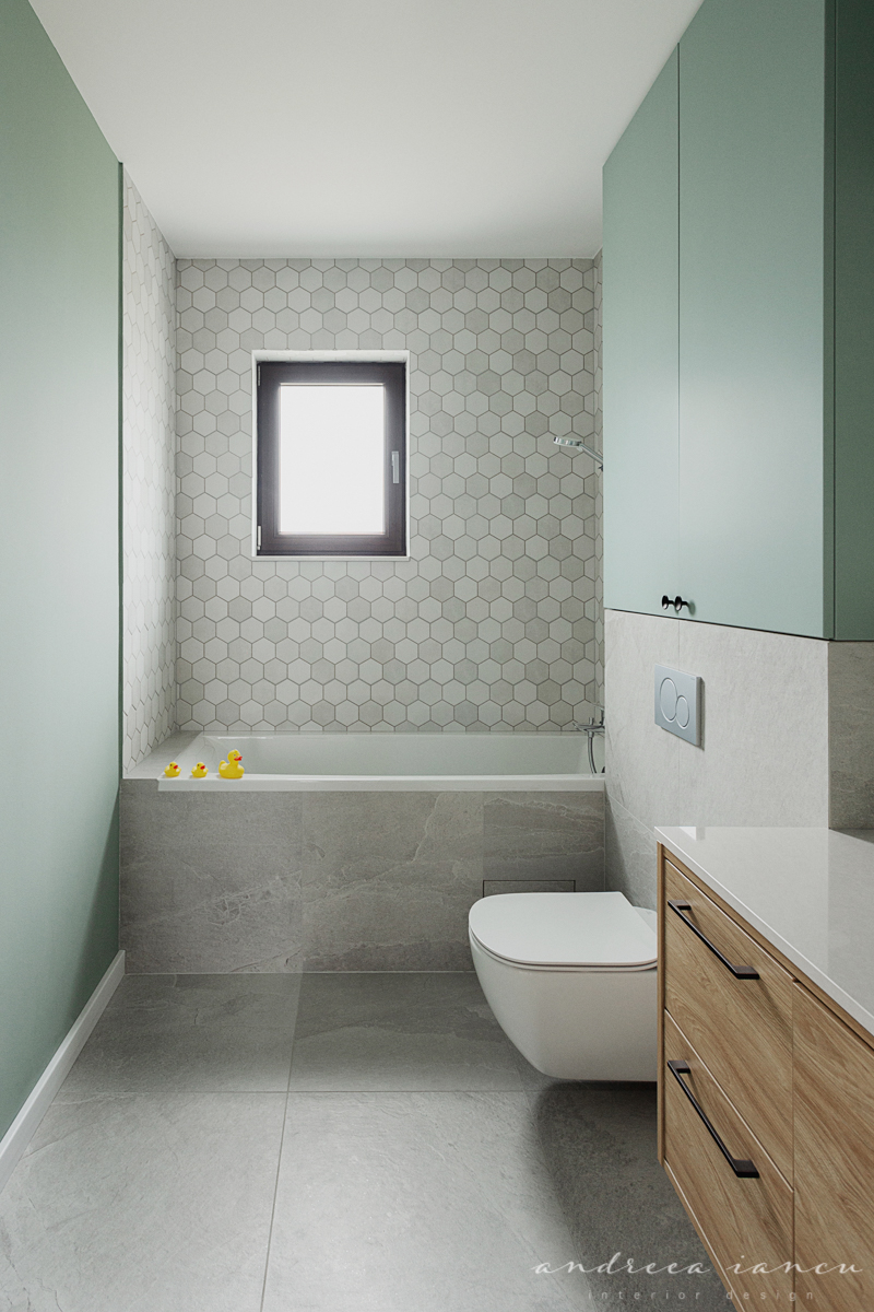 Green and grey bathroom with hexagonal tiles and warm wood furniture.